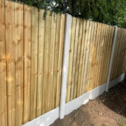 Concrete posts with featherboard fence panels installed by Tatton Fencing