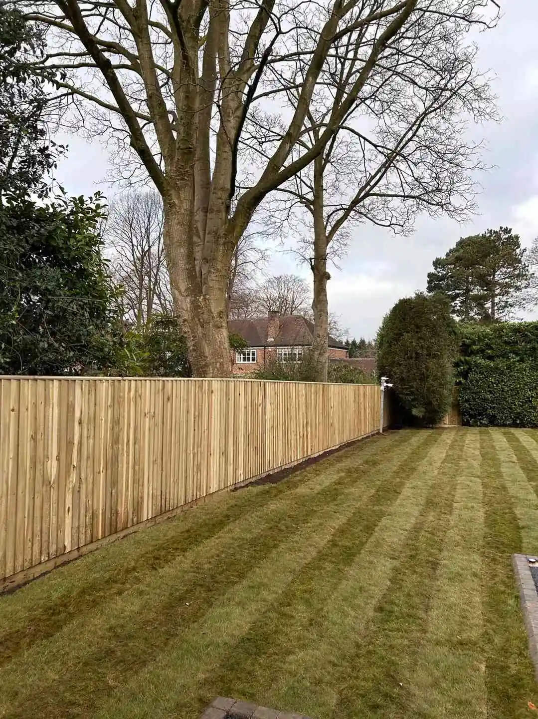 Continuous Featherboard fencing installation by Tatton Fencing
