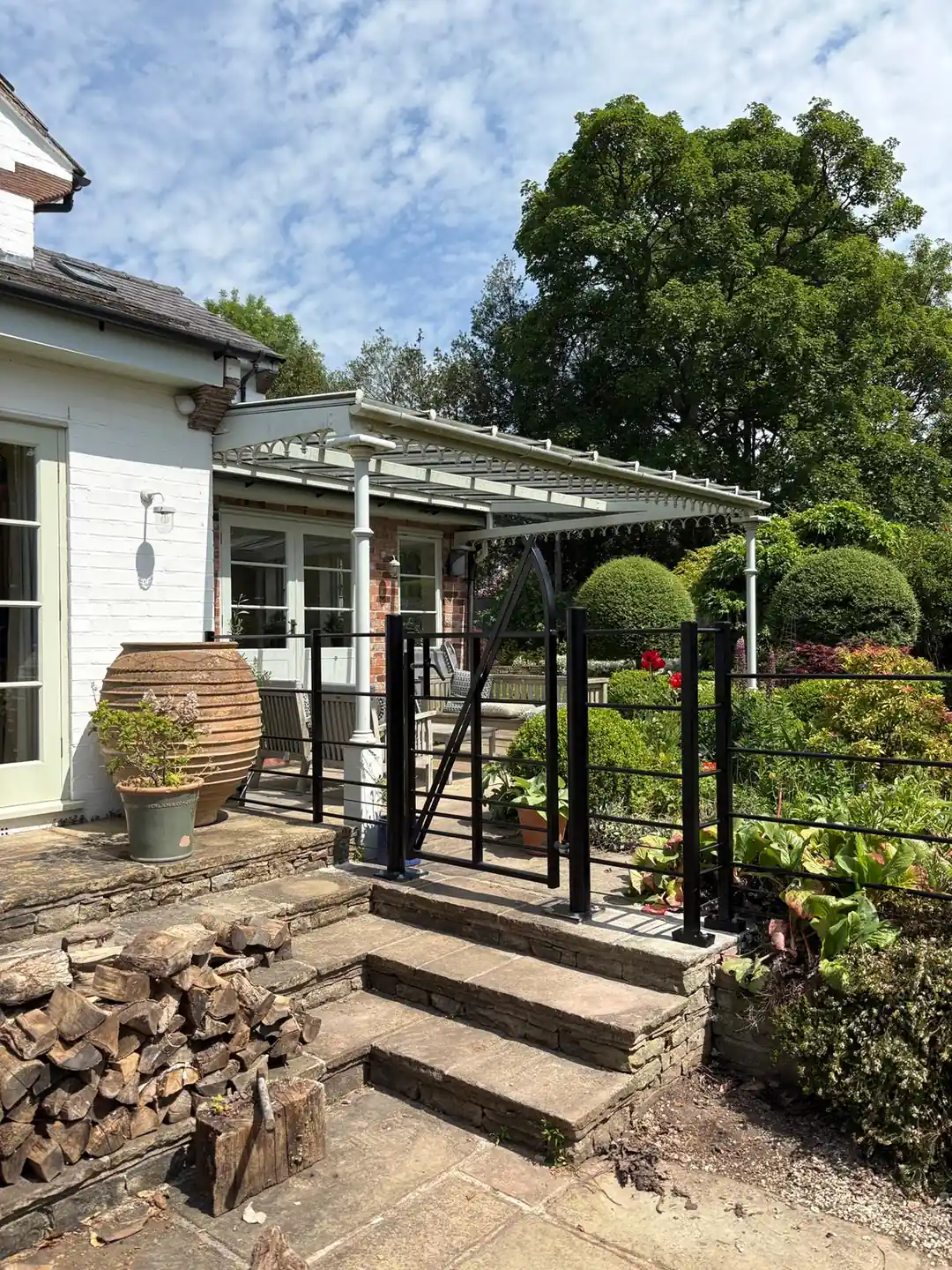 Modern estate railing panels and matching gate installed by Tatton Fencing