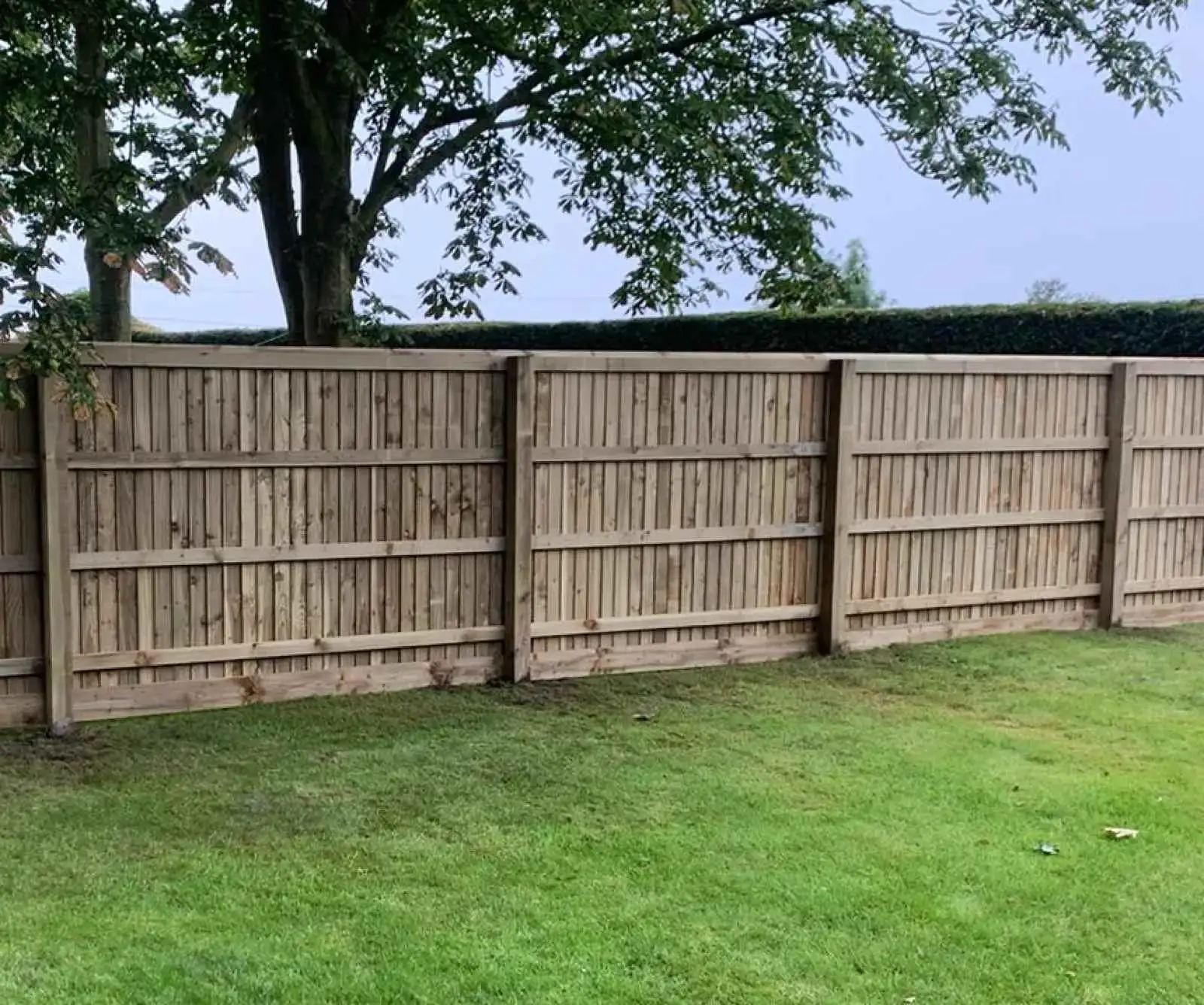 Continuous Featherboard fencing installation by Tatton Fencing